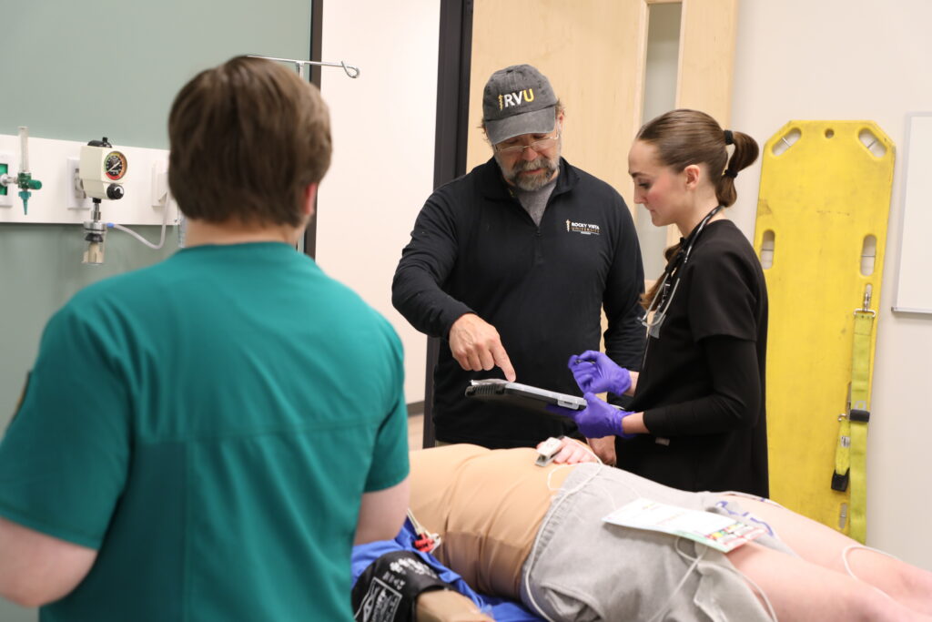 Decorative image. An RVU faculty member teaching a student.