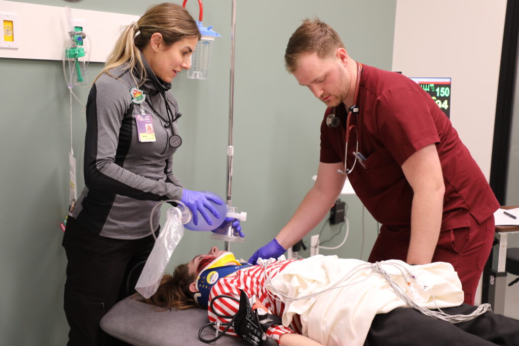 RVU student treats a patient with simulated injuries during a mass casualty simulation.