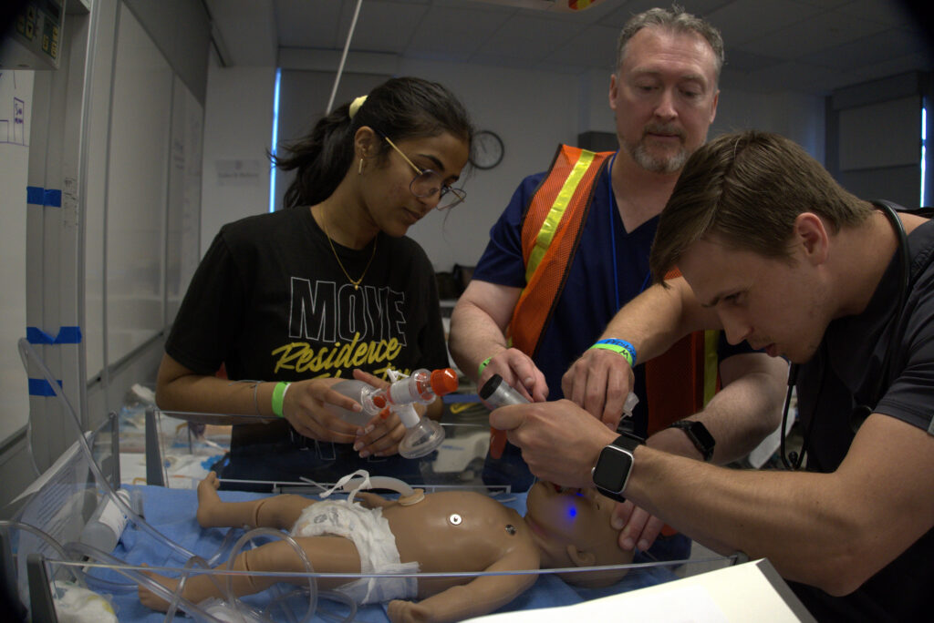 RVU students treat a baby manikin.