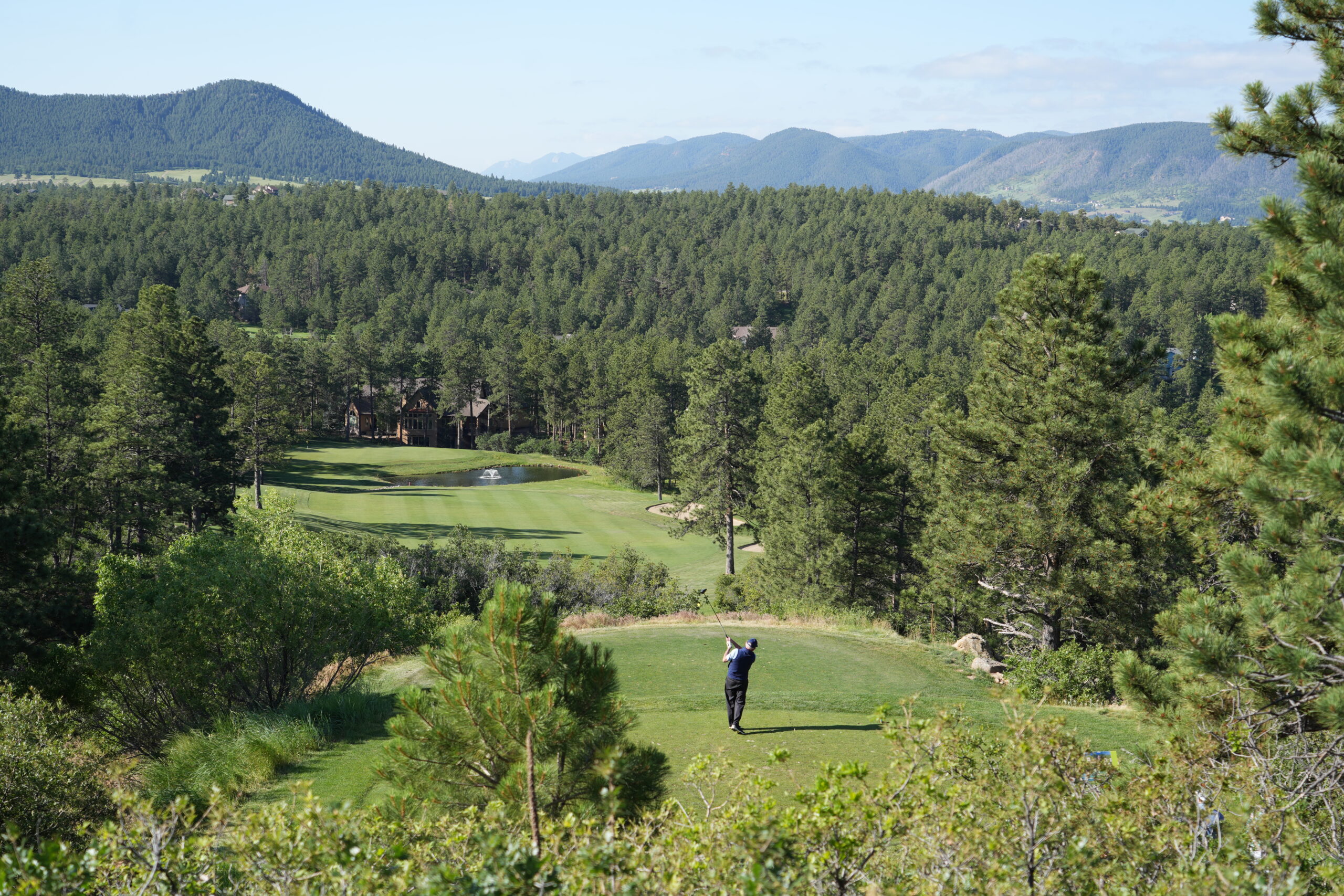 Golfer tees off during 7th Annual DOF golf tournament