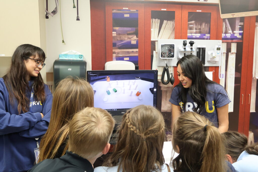 RVU students share video demonstration to elementary students.