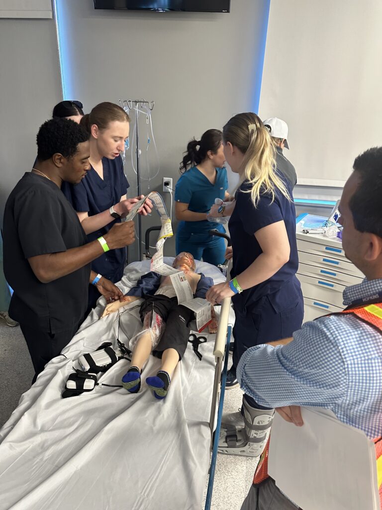 RVU students treat a child manikin during a mass casualty simulation.