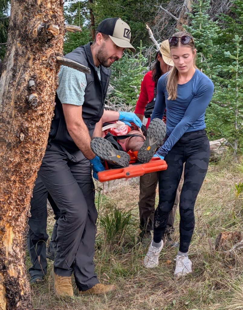 RVU students carry a simulated patient on a stretcher on Vail Mountain.
