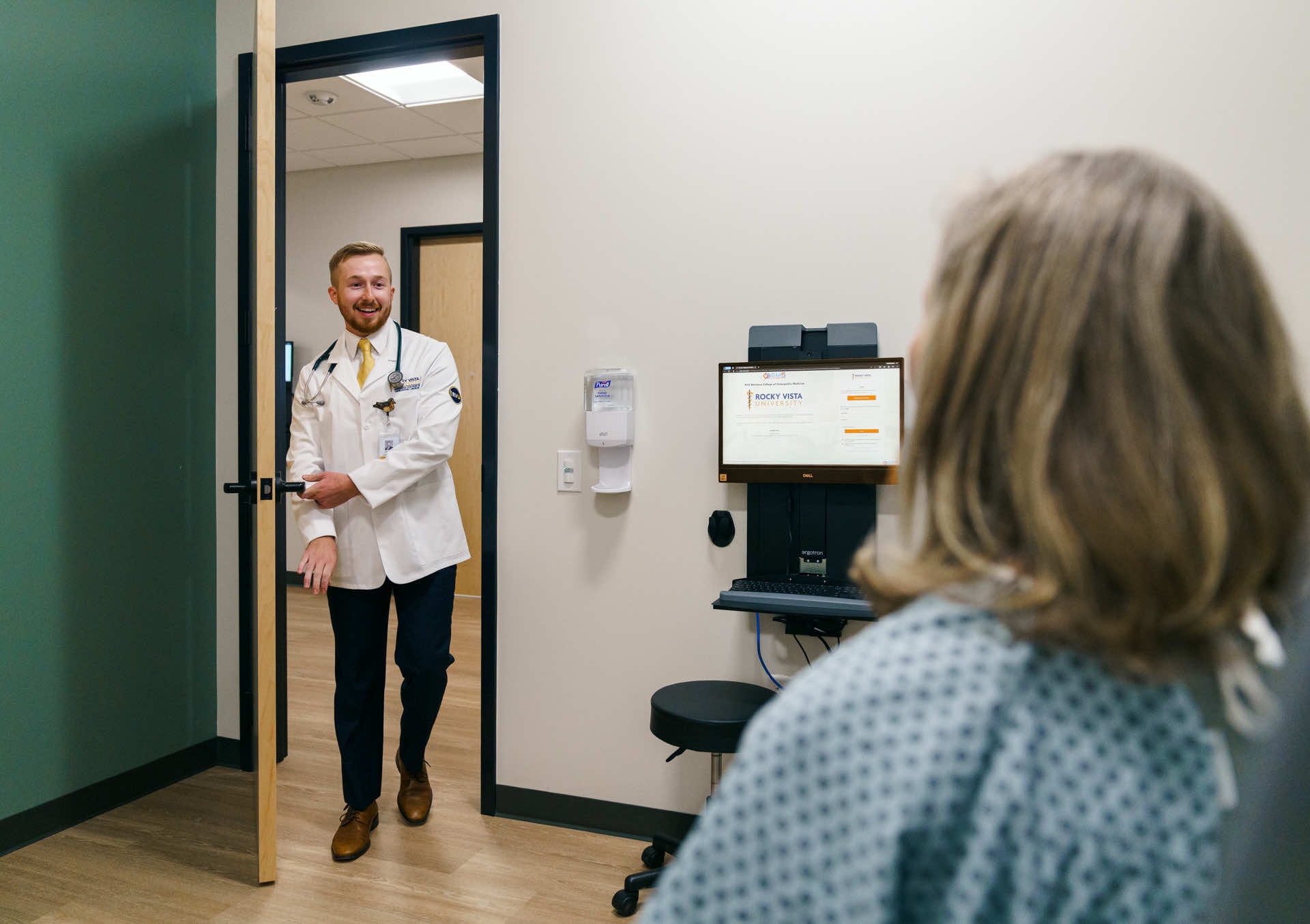 Doctor walking into patients room.